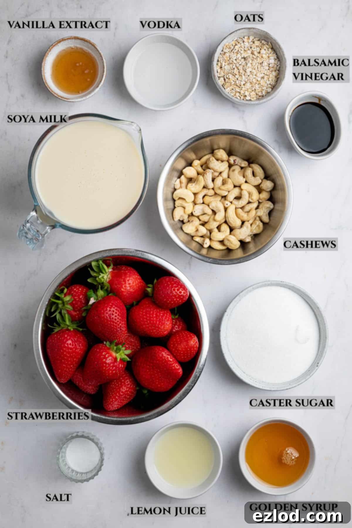 A labelled photo of the ingredients needed to make vegan strawberry ice cream.