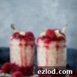 Raspberry almond overnight oats - get prepared with this super simple recipe for a tasty make-ahead breakfast of creamy almond flavoured oats with raspberry compote.