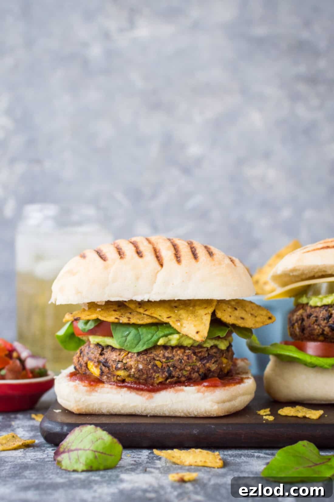 Vegan Mexican Bean Burgers – spicy black and kidney bean burgers with sweetcorn and chipotle. Each burger provides one of your five a day! Hashtags: #vegan #plantbased #beanburger #mexican #texmex #burger