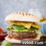 Flavorful and spicy Vegan Mexican Bean Burgers with black beans, kidney beans, sweetcorn, and chipotle, offering one portion of your daily five a day.