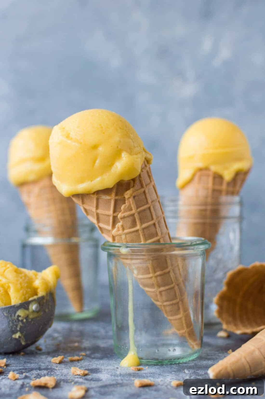 Mango lassi sorbet - a smooth, tangy vegan sorbet made with fresh mangoes, coconut yogurt and lime. The perfect refresher for hot weather! #vegan #icecream #sorbet #mango #yogurt