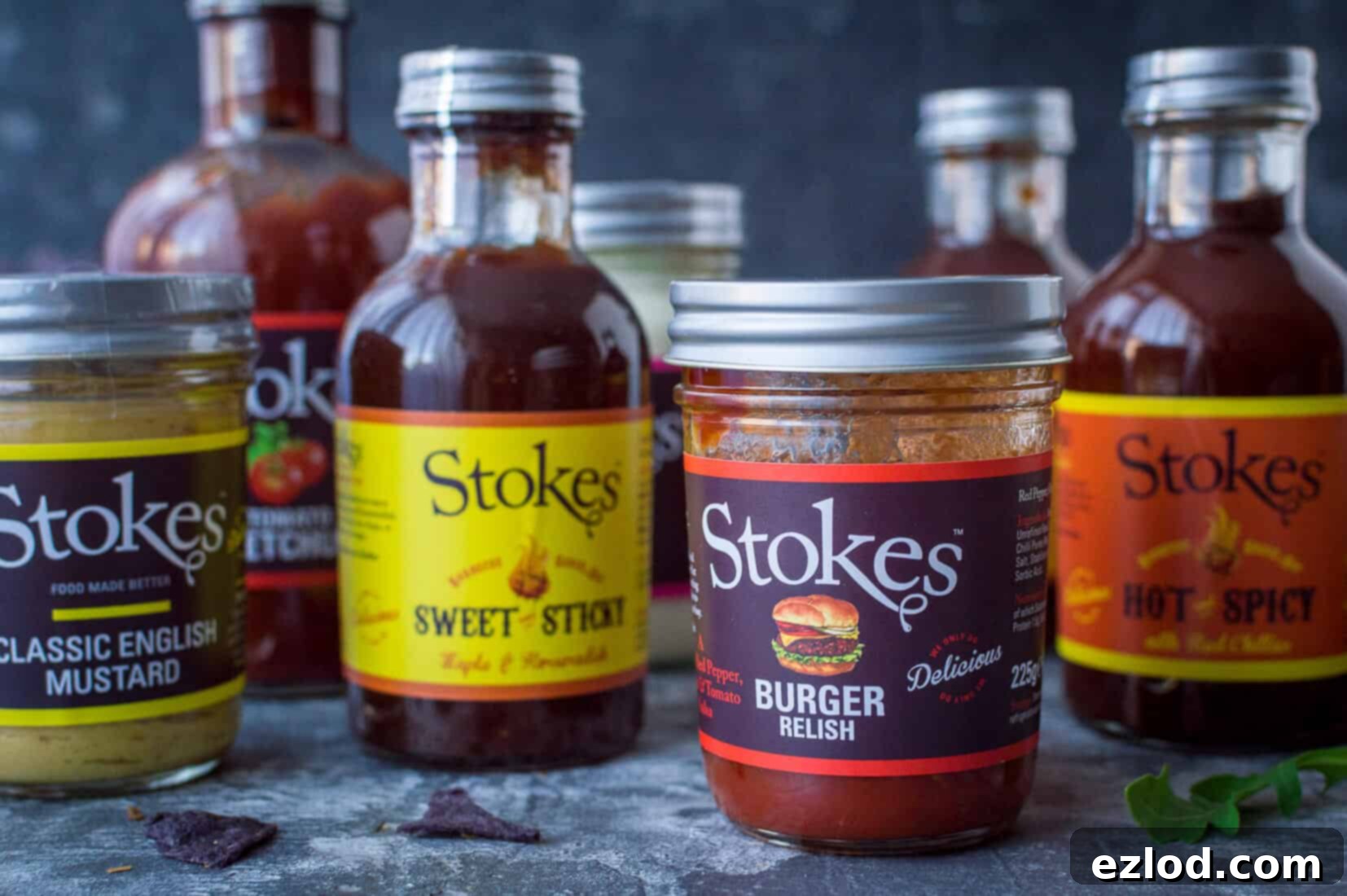 A beautifully arranged selection of high-quality Stokes Sauces bottles, including various ketchups, mayonnaise, and BBQ sauces, showcasing the brand's diverse range.