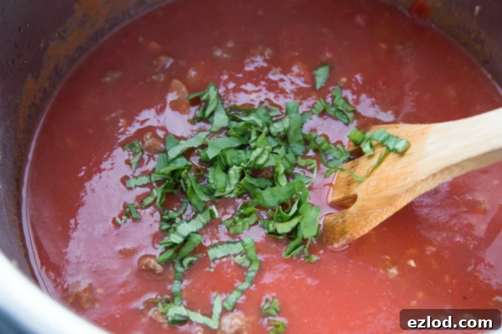 Instant Pot Lasagna soup topped with a ton of fresh basil