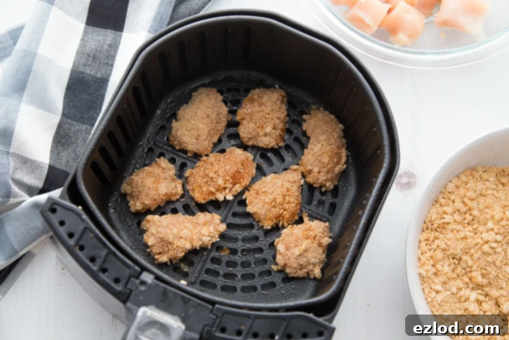 An overhead shot of a basket of Gluten-free Air Fryer Buffalo Chicken Nuggets for the 21 Day Fix 