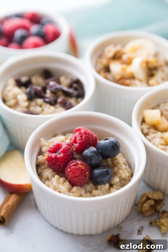 Four bowls of Instant Pot Steel Cut Oats with various fruit toppings