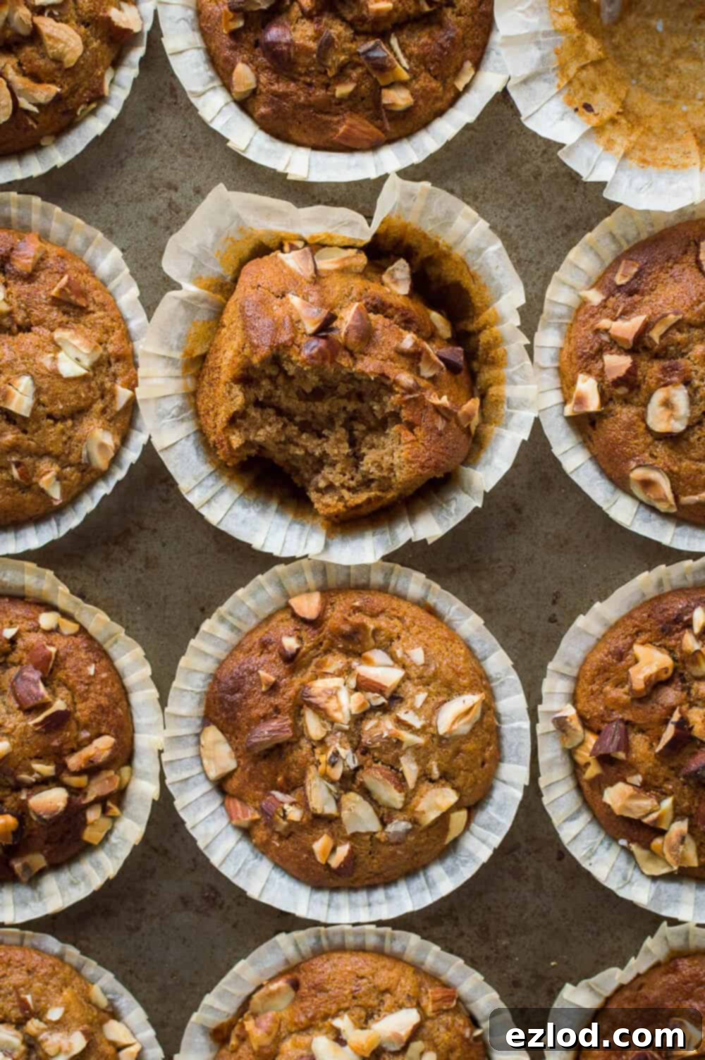 Banana nut muffins - moist, flavourful, quick and easy to make vegan banana muffins filled with chopped mixed nuts. Perfect for breakfast or snacking. #vegan #veganbaking #muffins #breakfast #snack