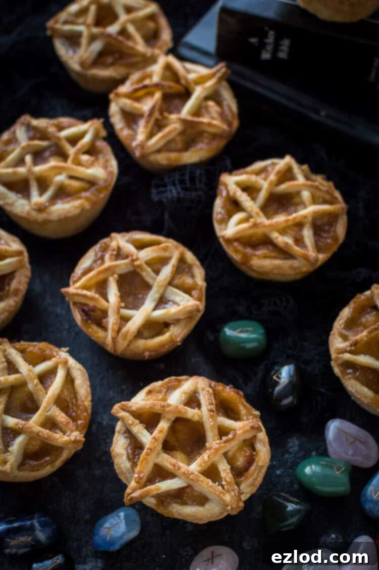 Pentagram topped vegan apple pies for Halloween - these mini vegan apple pies are topped with a pastry pentagram; perfect for Halloween and fans of Supernatural! Step by step instructions included. #vegan #Halloween #applepie