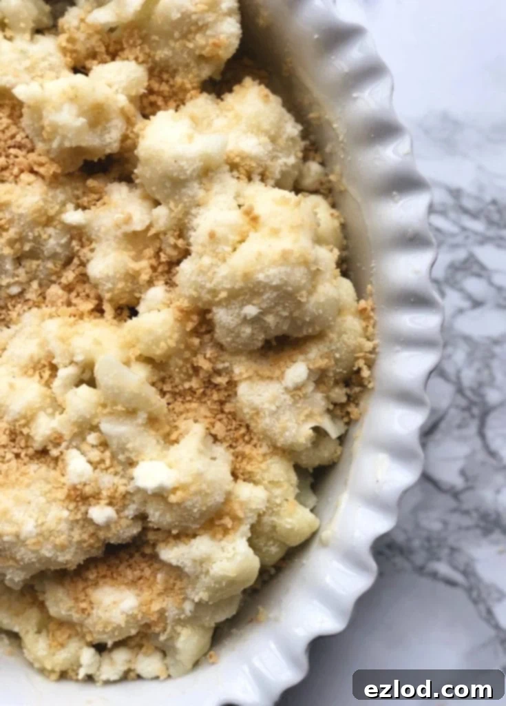Low Carb Cauliflower Au Gratin sitting on a marble background 