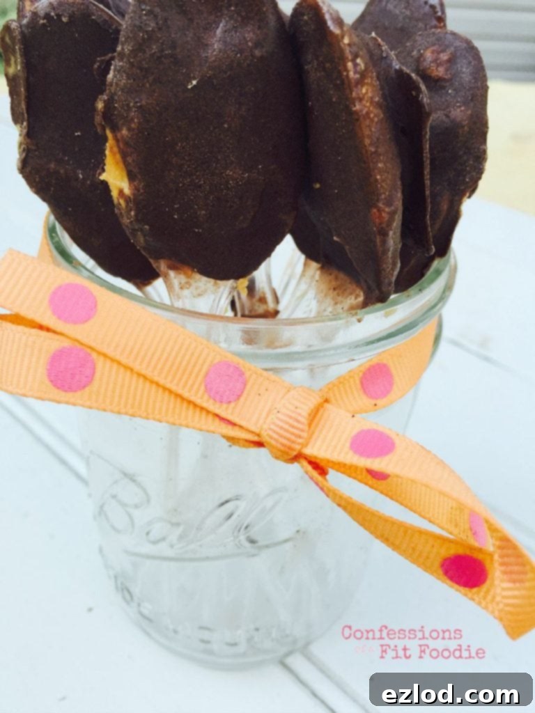 Frozen chocolate peanut butter on a spoon is the ultimate frozen treat for anyone on the 21 Day Fix! Tastes like a frozen peanut butter cup! Recipe on ConfessionsOfAFitFoodie.com