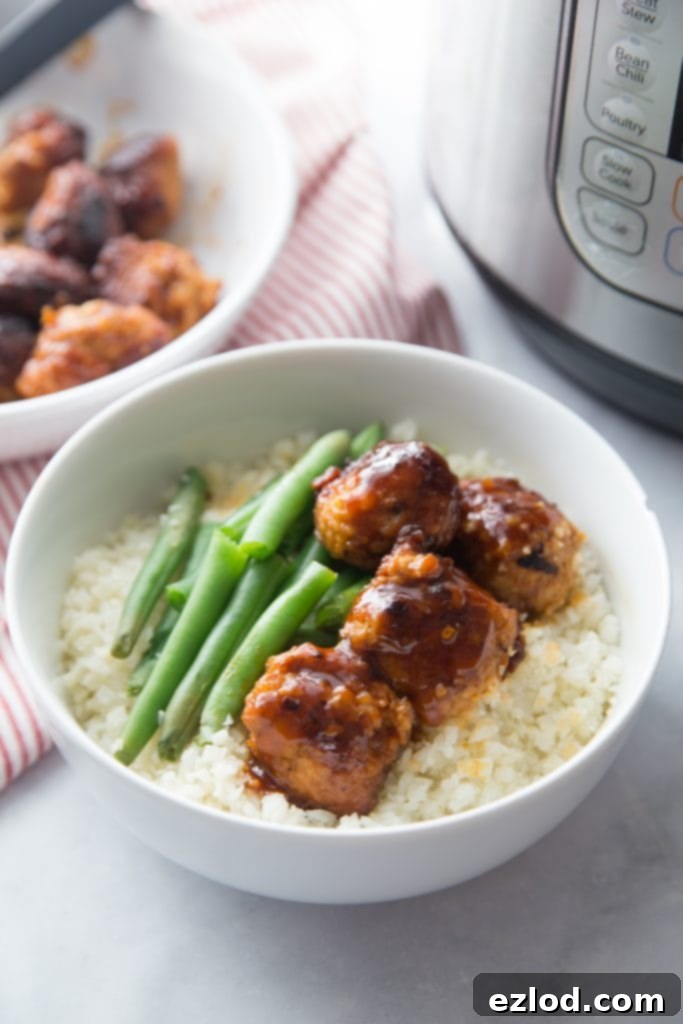 A bowl of Asian chicken meatballs over cauliflower rice 