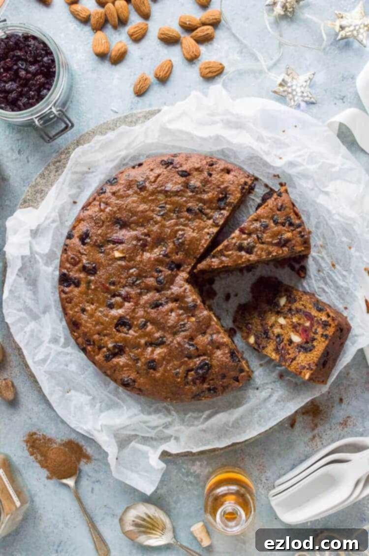 A beautifully rich, moist, and boozy vegan Christmas fruitcake, perfect for festive celebrations. Enjoy it fresh or matured with brandy. This ultimate vegan fruitcake recipe is a holiday baking essential. #vegan #christmas #cake #fruitcake #holidaybaking