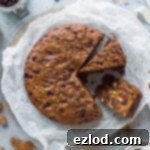 Plant-Based Christmas Delight 12 A delicious slice of rich vegan Christmas cake, highlighting its moist texture and fruit-filled interior, a perfect festive treat.