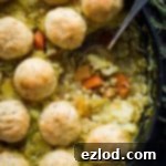 A hearty vegan winter vegetable and pearl barley stew with herby dumplings, perfect for chilly days. This comforting and healthy meal is topped with fluffy, aromatic dumplings.