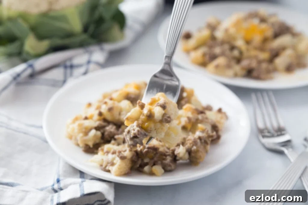 Delicious Instant Pot Cauliflower Cheeseburger Mac, a healthy low-carb alternative to Hamburger Helper, garnished with fresh herbs.