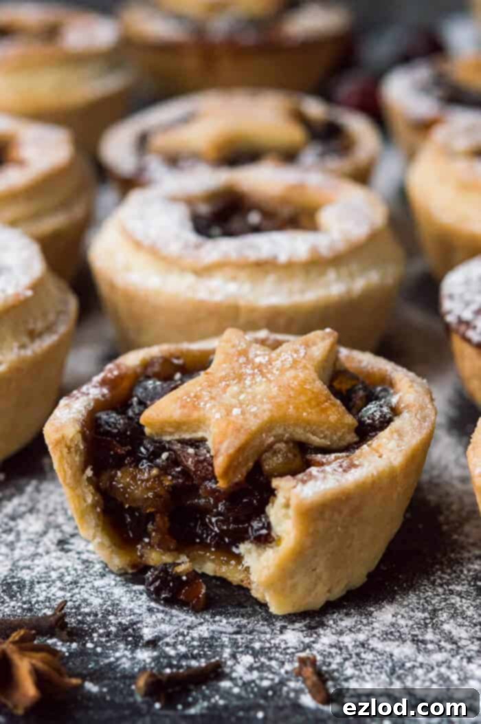 Close up of a vegan mince pie with a bite taken out of it.