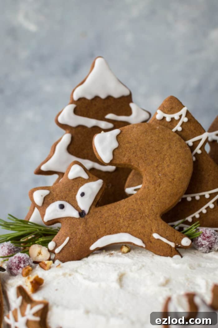 Close up of a decorated vegan gingerbread fox cookie, part of the festive woodland ginger cake.