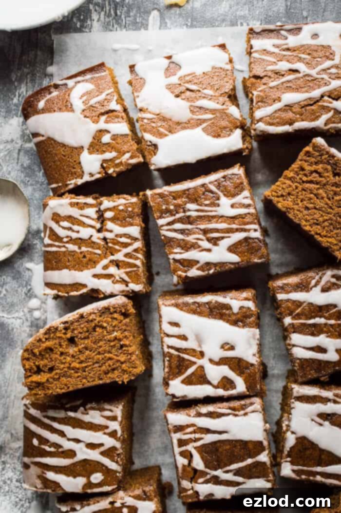 easy ginger cake with lemon glaze on a grey background.