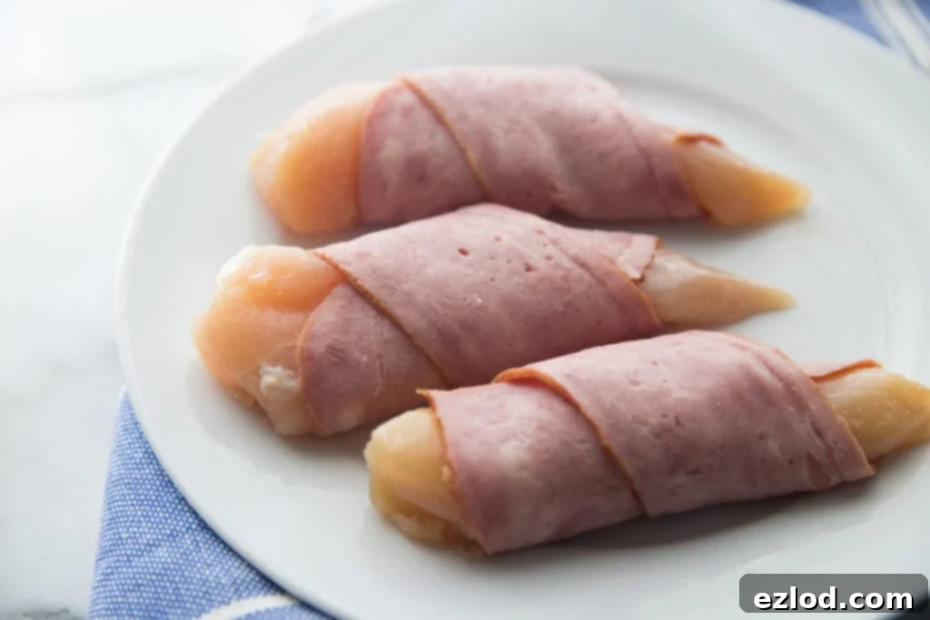 A plate of chicken tenders wrapped in bacon 