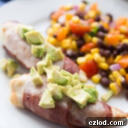 Air Fryer Bacon Wrapped Chicken Tenders with cheese and avocado