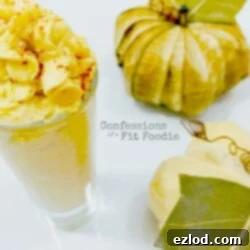 A shot glass filled with creamy Vegan Pumpkin Frosting, a perfect fall dessert treat or a topping for coffee.