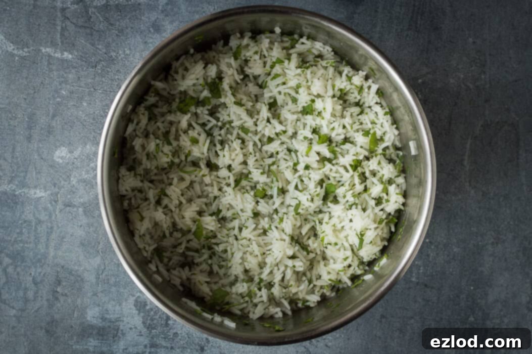 The process of preparing fluffy coriander rice, showing the cooked rice being mixed with fresh green coriander in a pot.