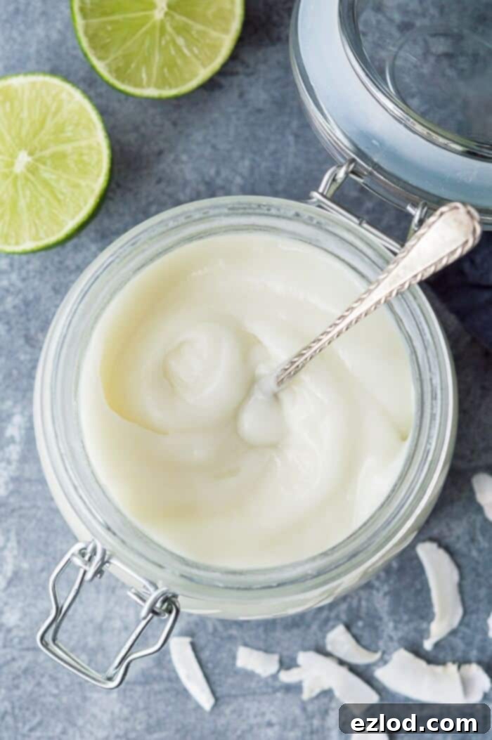 Close up of a jar of coconut lime curd.