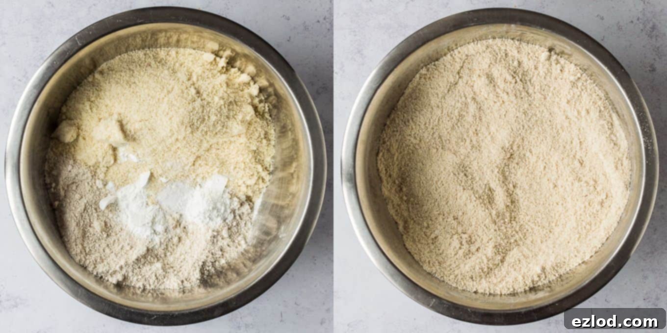 Step 1: Dry ingredients – oat flour, ground almonds, baking powder, and salt – being whisked together in a large mixing bowl.