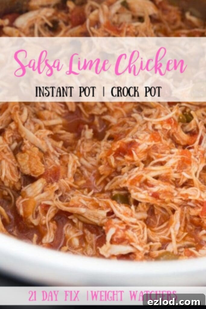 Close-up of shredded Salsa Lime Chicken with fresh cilantro and lime wedges, perfect for garnishing.