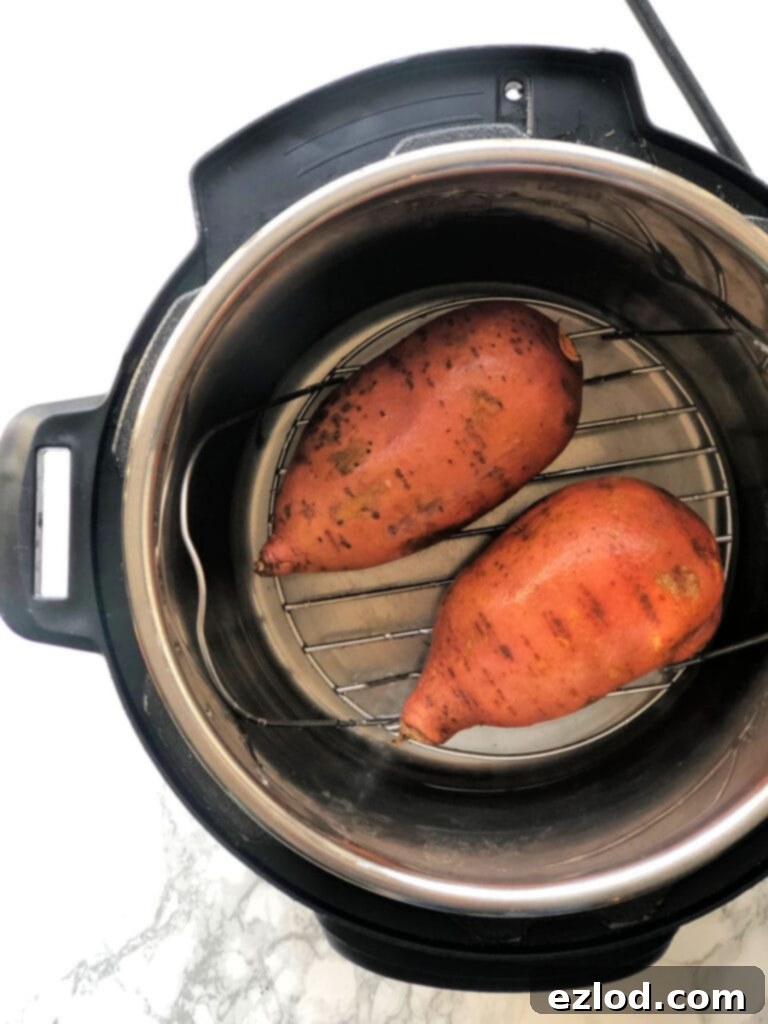A photo of two sweet potatoes in the Instant Pot