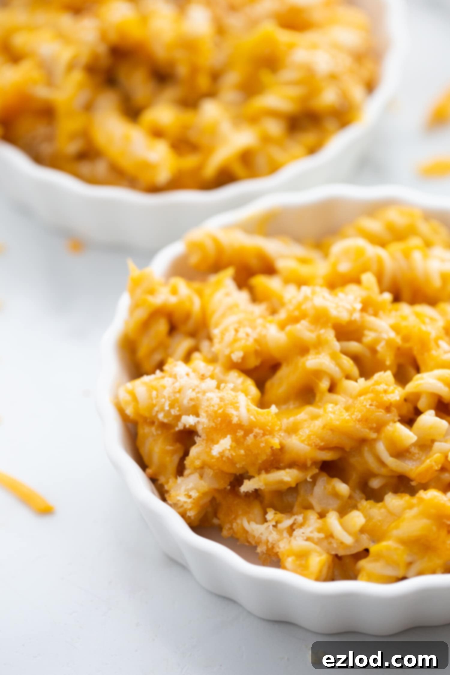 Individual ramekins filled with creamy butternut squash mac and cheese