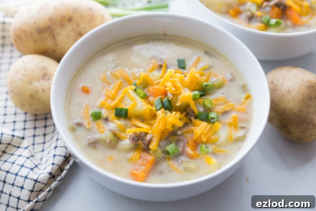 A bowl of the best cheeseburger soup made with real food like potatoes, ground beef, freshly shredded cheese, and cauliflower 