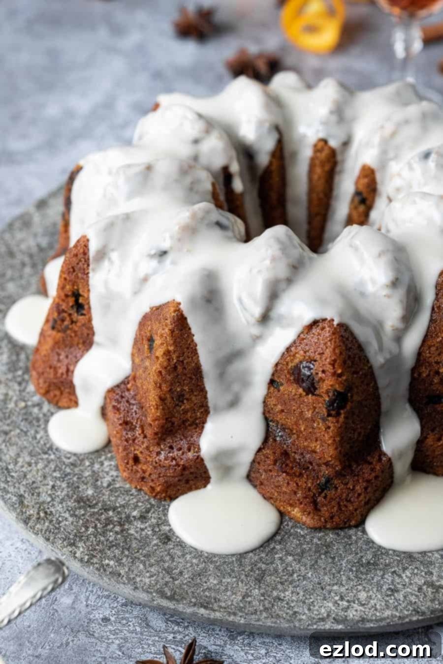 Vegan mincemeat cake - this Christmassy vegan bundt cake is perfect for using up mincemeat (of the fruit variety!) or is a great festive alternative to a traditional Christmas cake. #bundtcake #vegancake #veganbaking #christmascake #christmas #festive #mincemeat Close up of vegan mincemeat bundt cake.