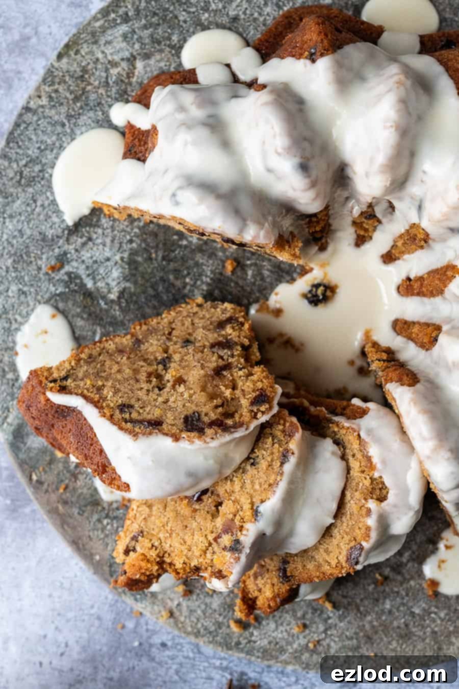 Vegan mincemeat cake - this Christmassy vegan bundt cake is perfect for using up mincemeat (of the fruit variety!) or is a great festive alternative to a traditional Christmas cake. #bundtcake #vegancake #veganbaking #christmascake #christmas #festive #mincemeat Close up of slices of vegan mincemeat cake.