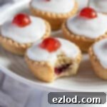 Irresistible Vegan Cherry Bakewells 13 Close up of a vegan cherry Bakewell with a bite taken out of it.