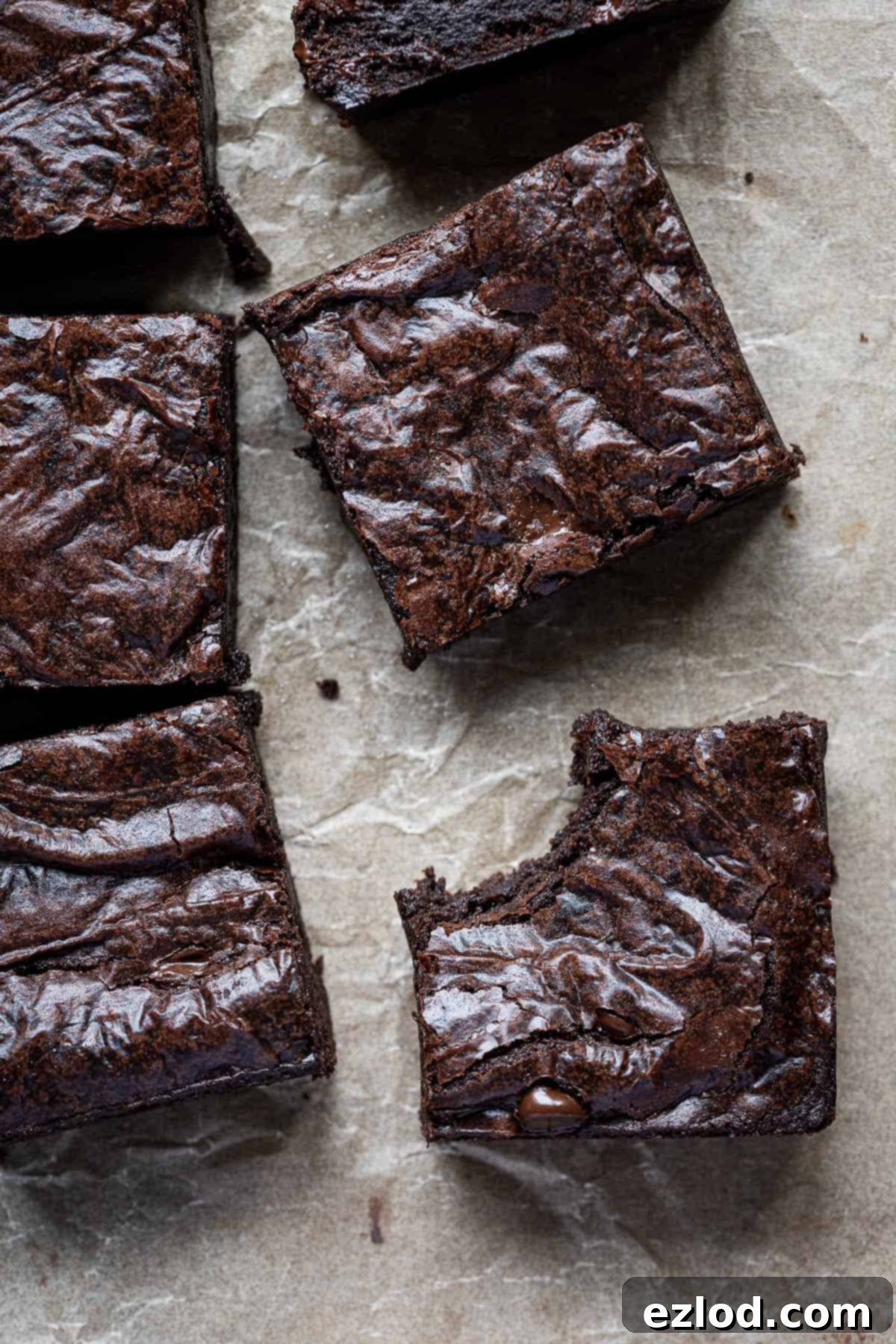 Seriously Fudgy Plant-Powered Brownies 11 Close up of a brownie with a bite taken out of it, showcasing its rich, dense, and moist texture.