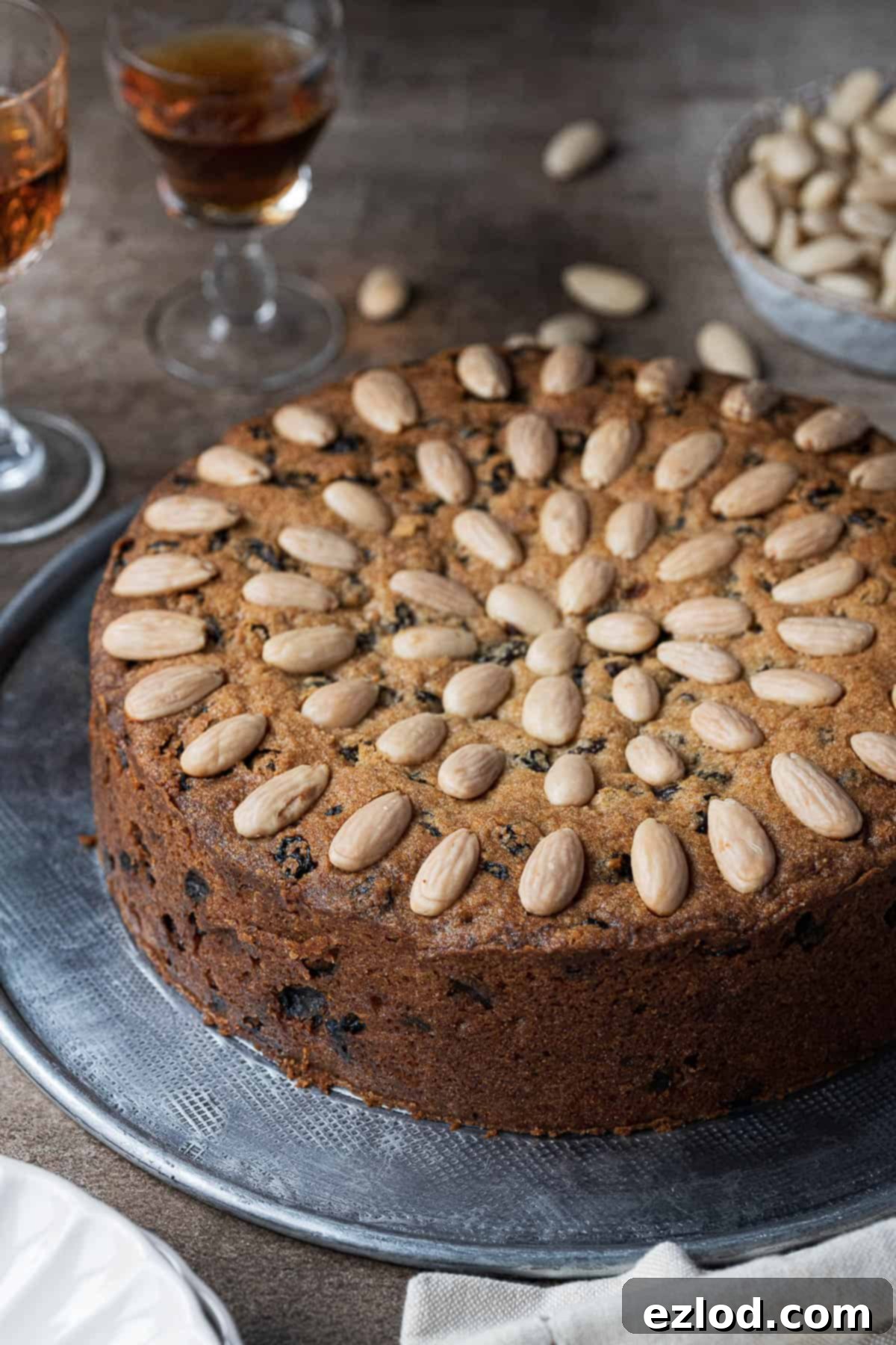 Plant-Based Dundee Cake 3 Side view of the un-sliced Dundee cake.