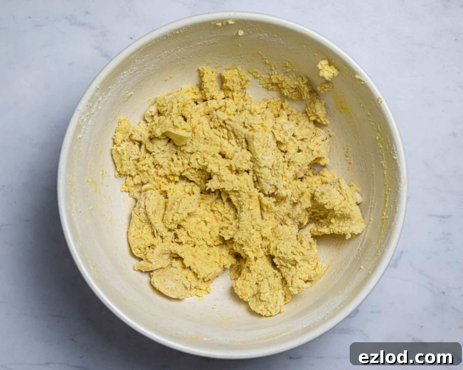 Vegan Zesty Cranberry Orange Shortbread 5 Step 2: Adding the sifted plain flour and cornflour to the creamed vegan shortbread dough mixture.