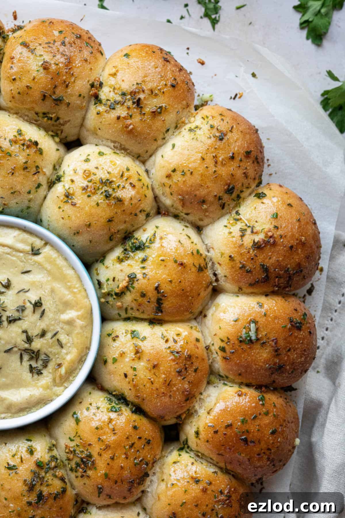 Pillowy Vegan Garlic Dough Balls 12 A close-up of a portion of the freshly baked vegan garlic dough balls, golden and inviting, ready to be pulled apart and enjoyed.