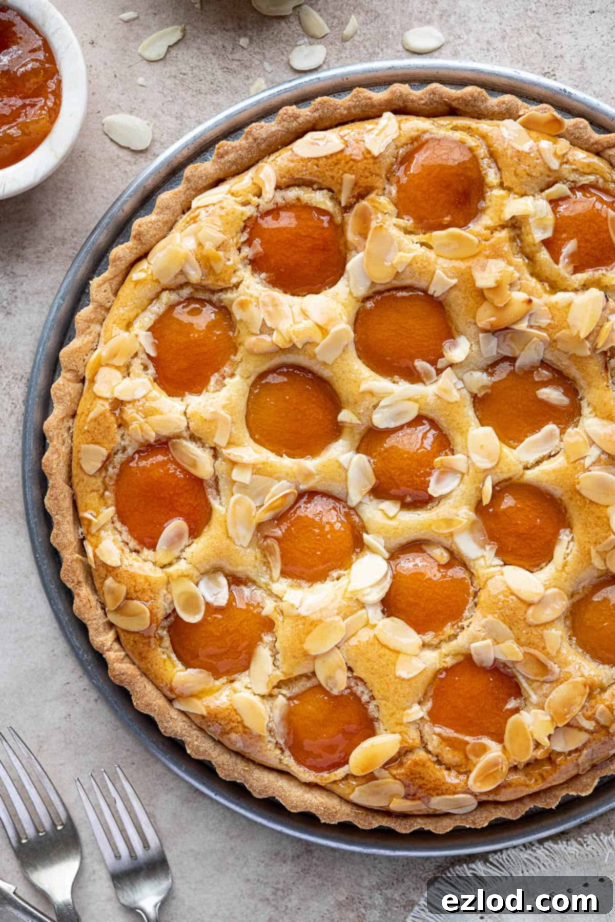 Plant-Based Apricot Frangipane Tart 4 A close-up view of the baked vegan apricot frangipane tart, showing the golden crust, rich almond filling, and perfectly arranged apricot halves.