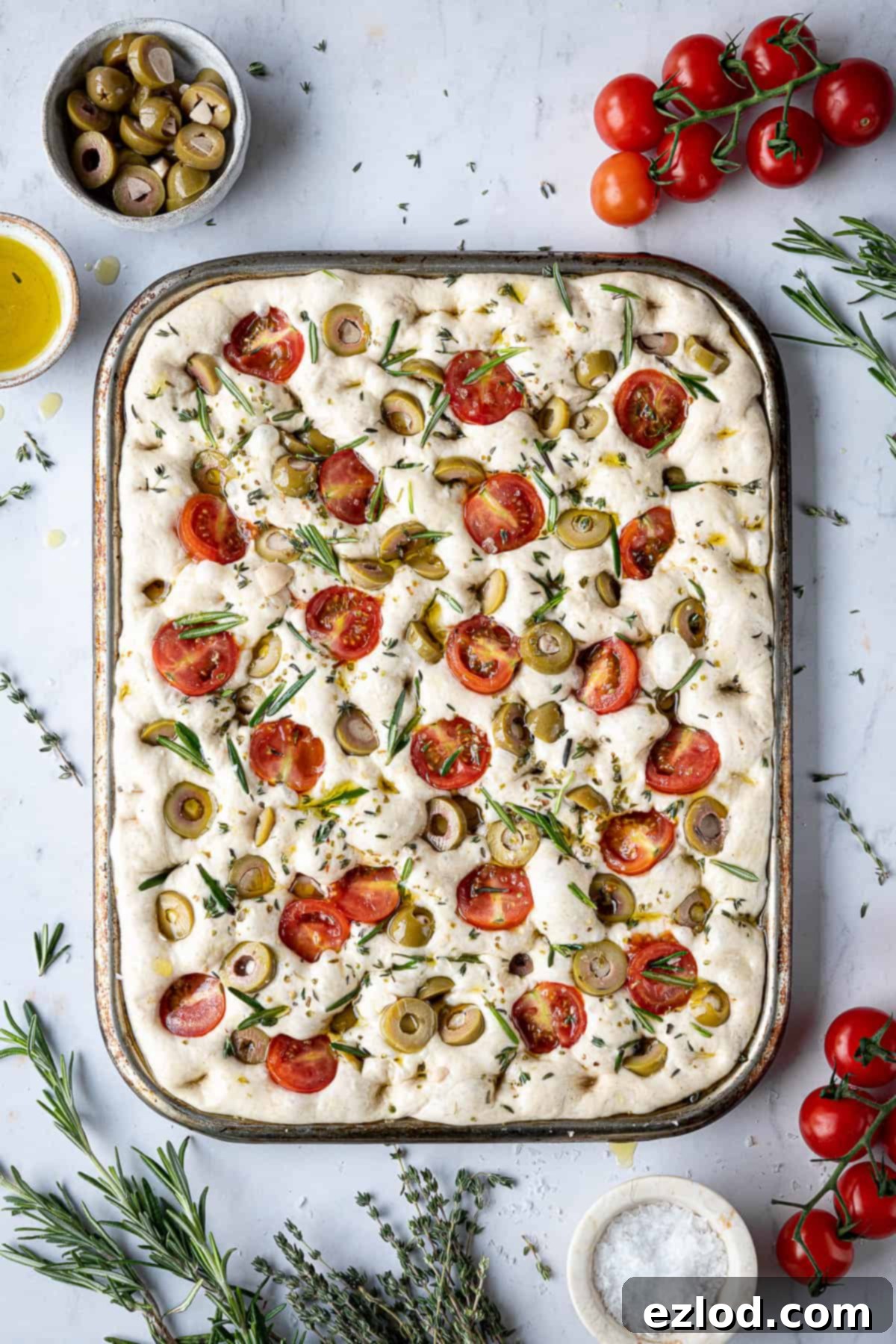 Baking Bliss and BBC Maestro Insights 12 The focaccia dough, generously drizzled with olive oil and dimpled, ready to bake.