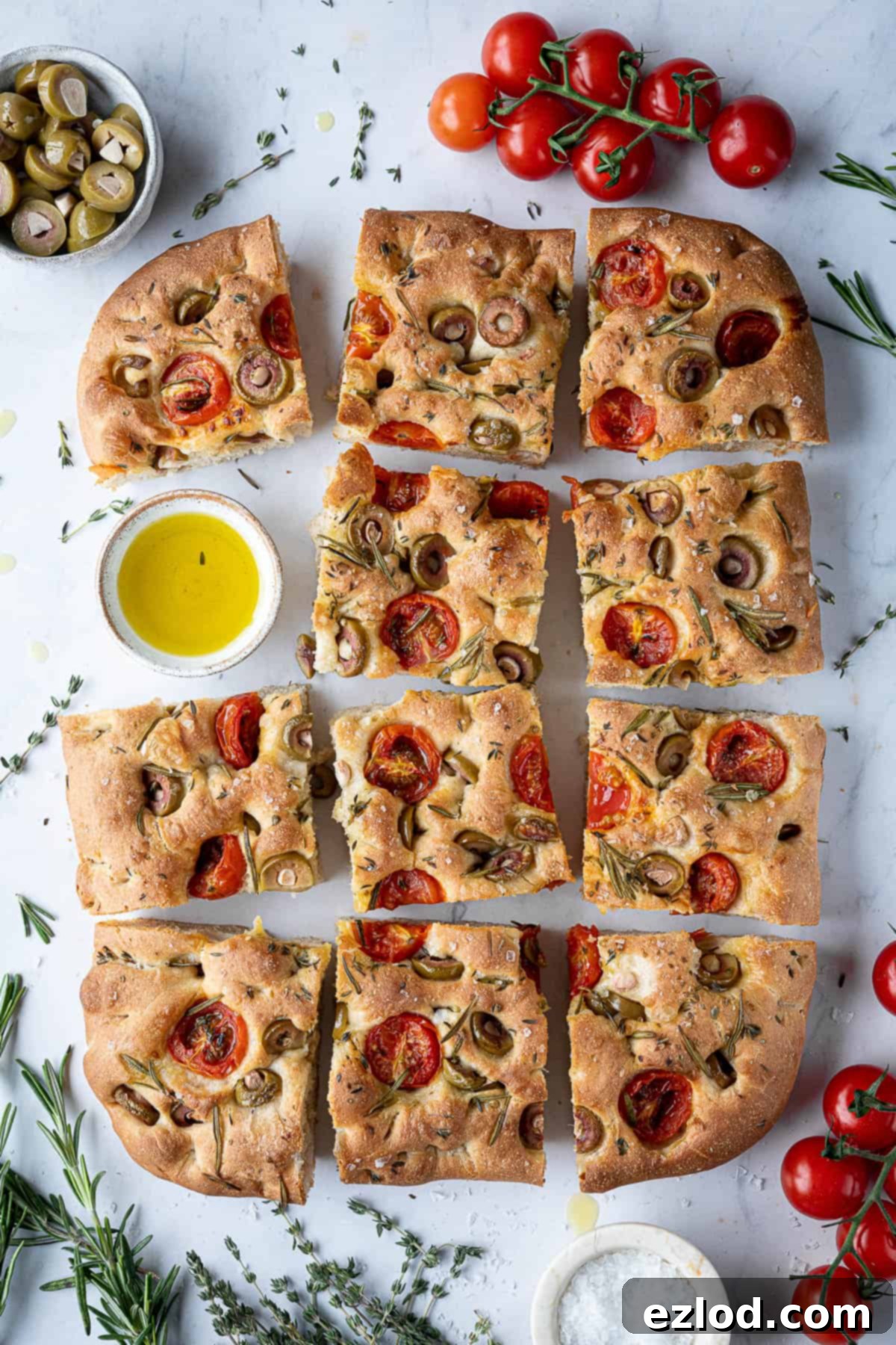 Baking Bliss and BBC Maestro Insights 4 Sliced tomato and olive focaccia, showing off its beautiful toppings and fluffy interior.