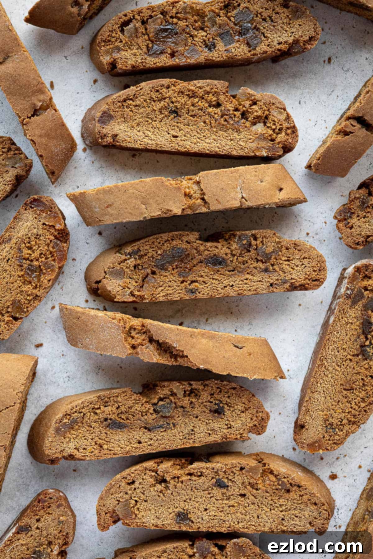 Warmly Spiced Vegan Gingerbread Biscotti 10 Gingerbread biscotti arranged in a row.
