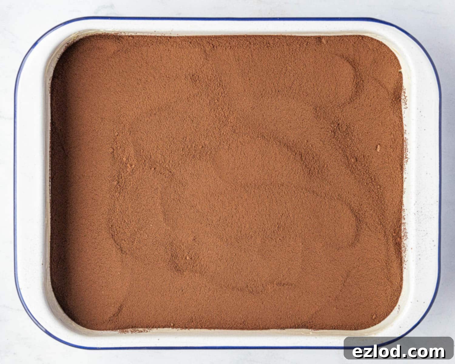 Decadent Vegan Chocolate Lava Pudding 8 Step 6, the batter topped with the sugar and cocoa powder.