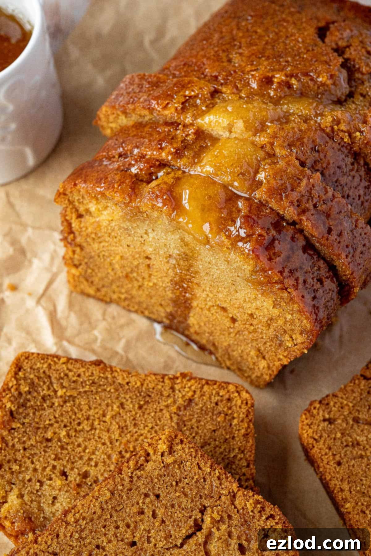 Vegan Liquid Gold Cake 3 Close-up view of several slices of vegan golden syrup cake, stacked and showing their soft, sticky texture and golden hue, ready to be enjoyed.