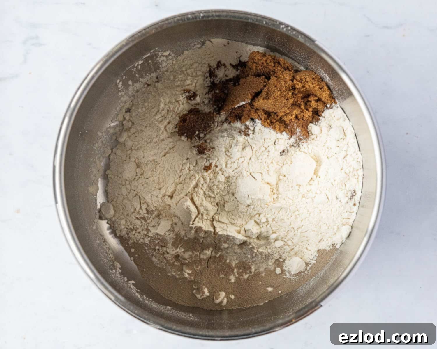 Jamaican Plant-Based Spiced Bun 5 Step 1: All dry ingredients (flour, yeast, sugar, spices) are measured and mixed in a stand mixer bowl.