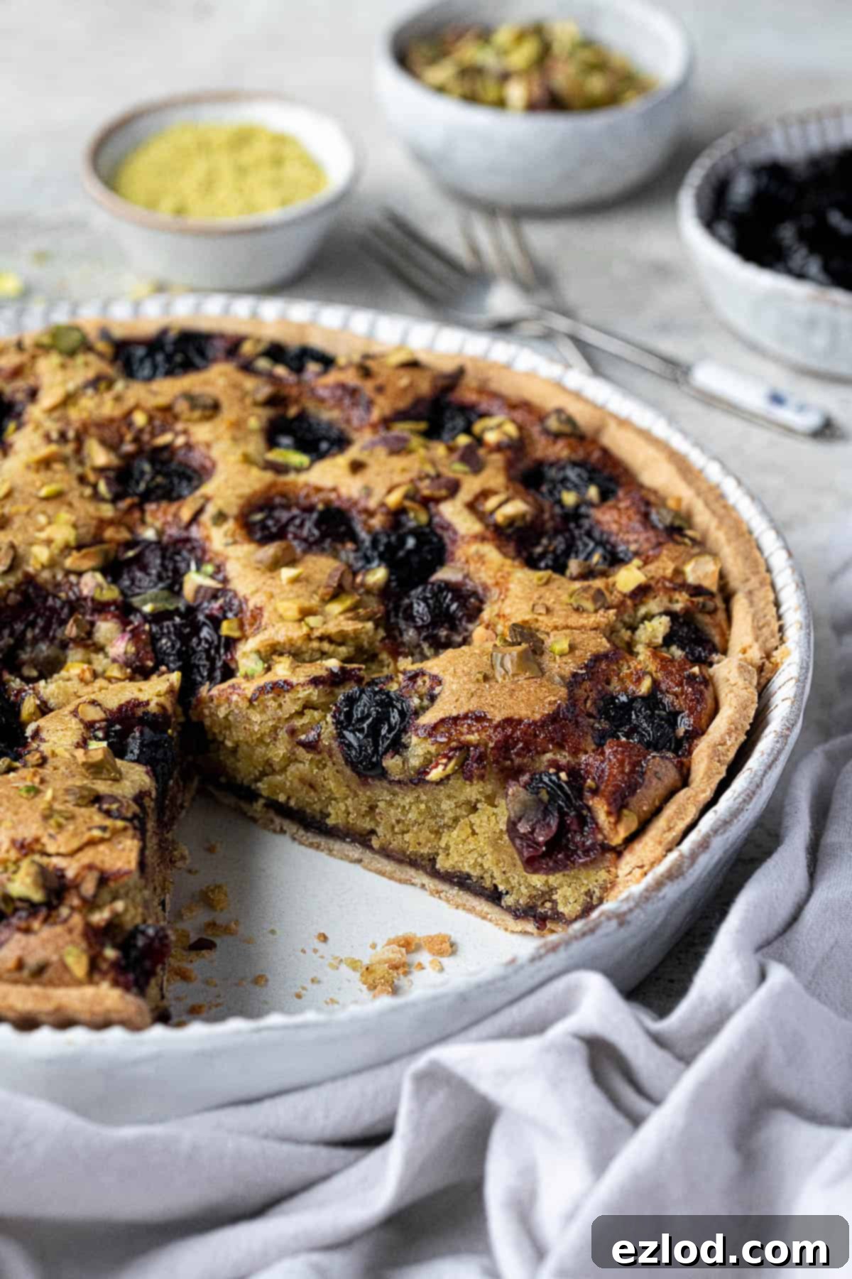 Heavenly Vegan Pistachio Cherry Frangipane Tart 3 Close up of the sliced tart.