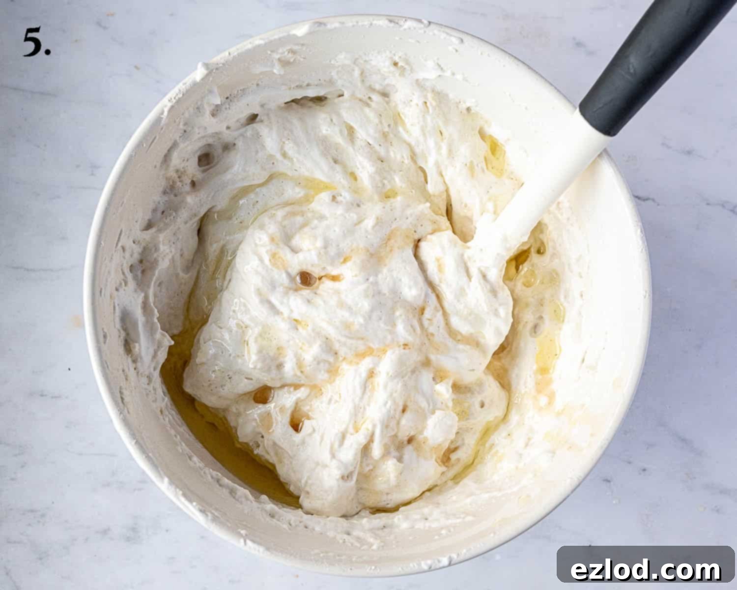Delicate Vegan Ladyfingers 8 Step 5 of the recipe: The oil and vanilla extract have been added to the meringue mixture.