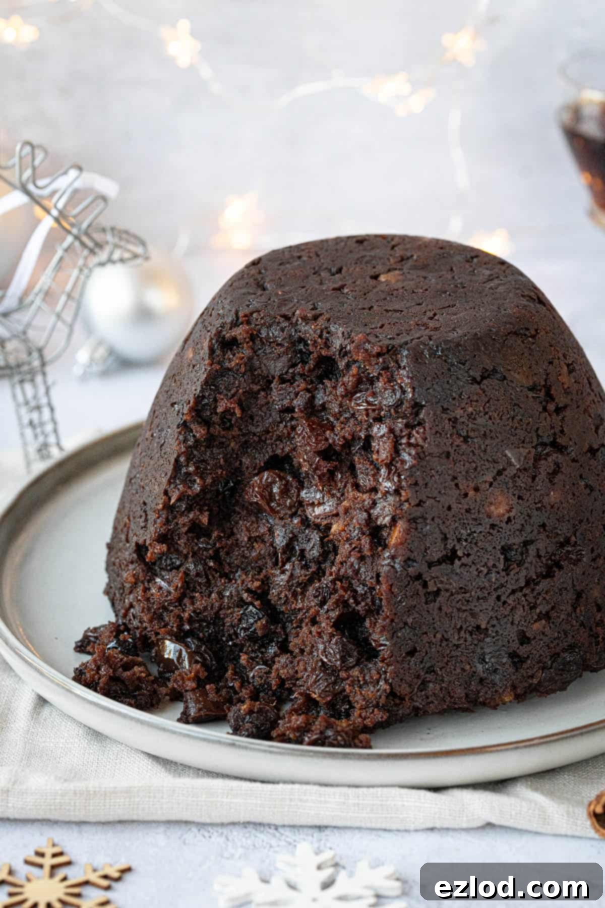 Guilt-Free Vegan Chocolate Christmas Pudding 4 Close up of the pudding with a spoonful removed.