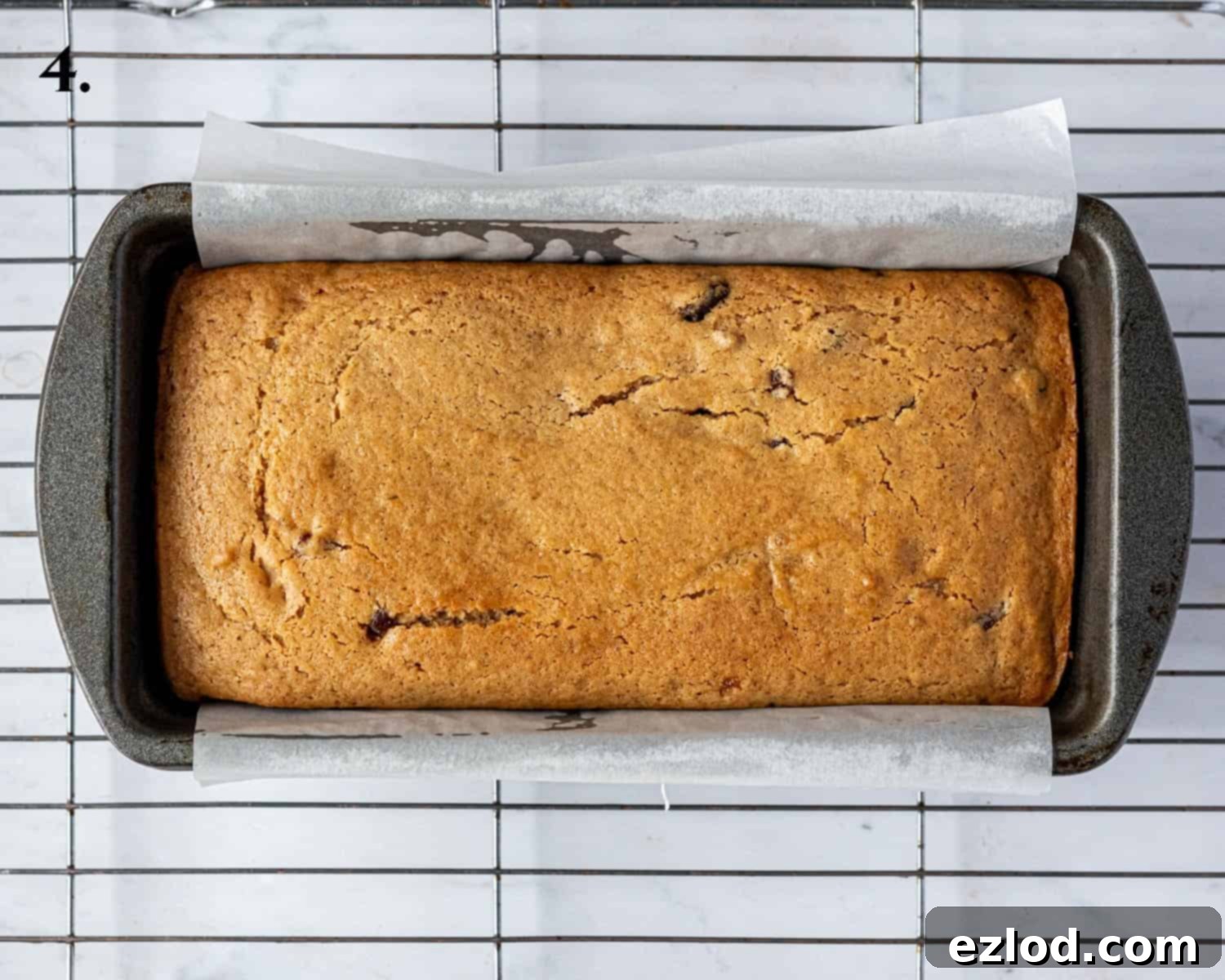 Zesty Vegan Marmalade Tea Loaf 8 Step 4: The freshly baked marmalade tea loaf, golden and fragrant, cooling in its tin.