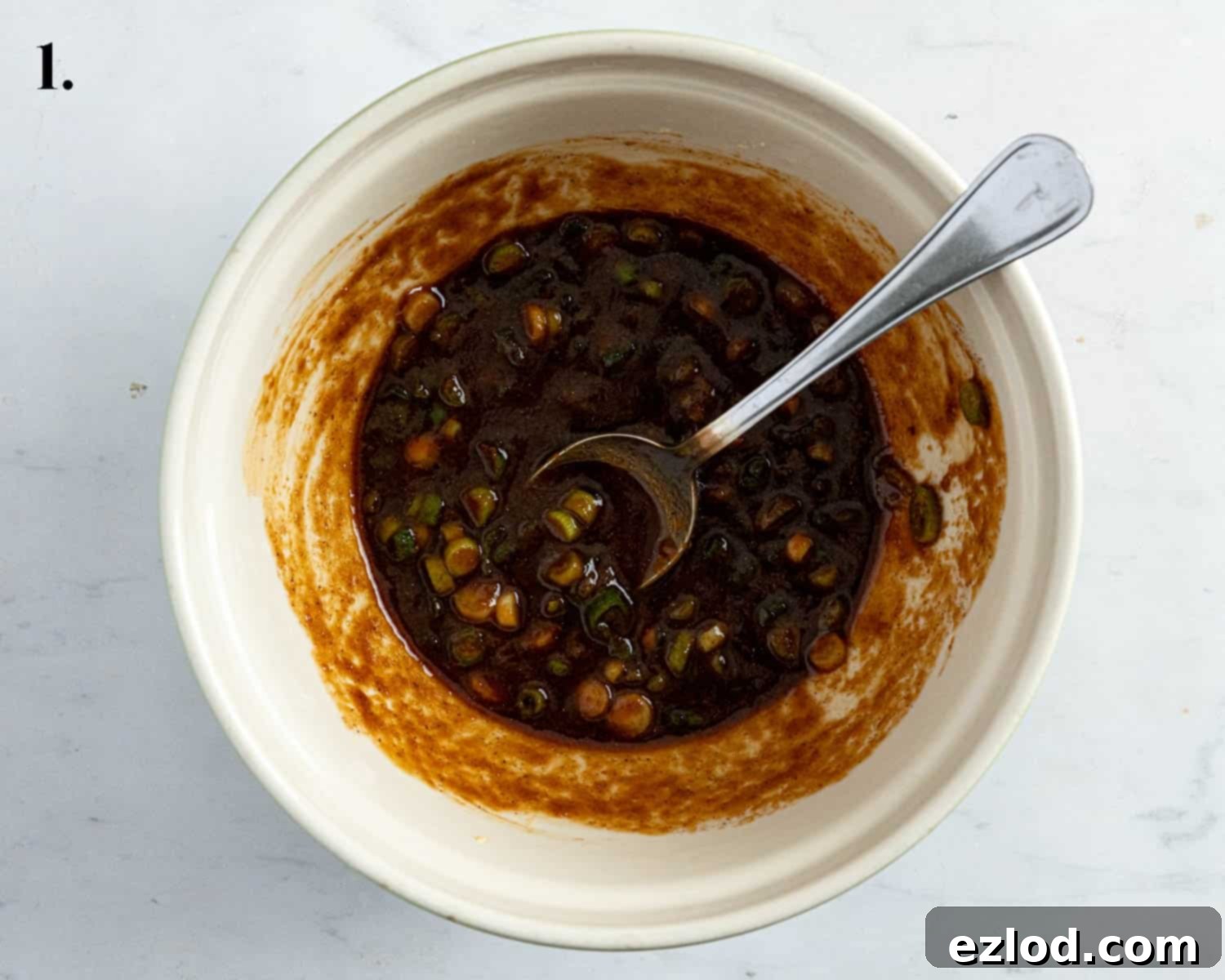 Pillowy Vegan Hoisin Tofu Bao Buns 5 Step 1, the hoisin marinade ingredients mixed in a bowl.